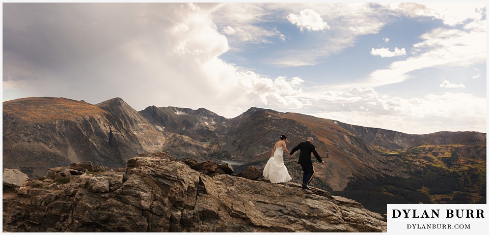 rocky mountain national park wedding colorado bride and groom hiking on top of the mountains