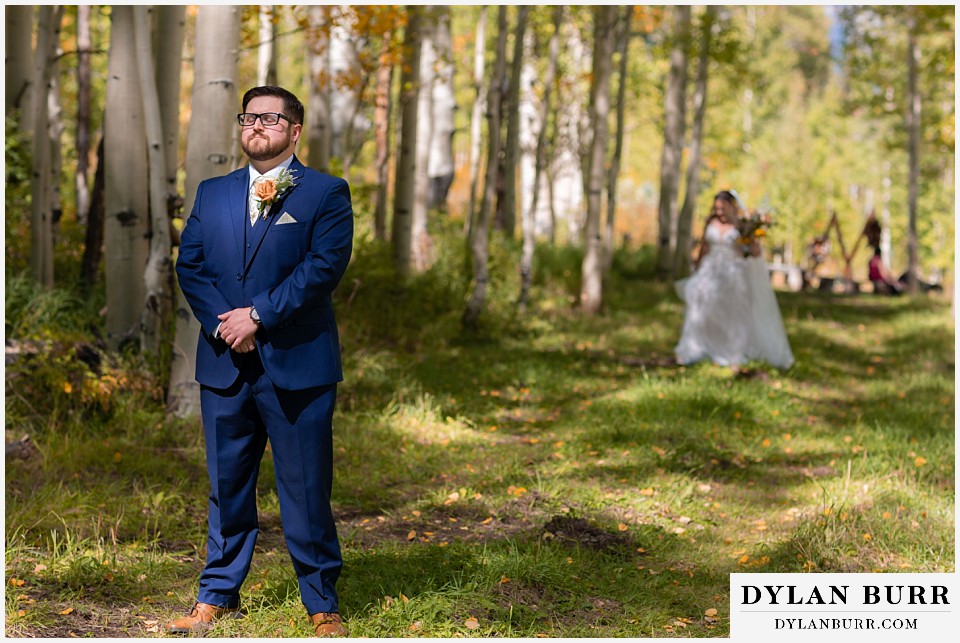 black diamond lodge wedding bride and groom first look in trees