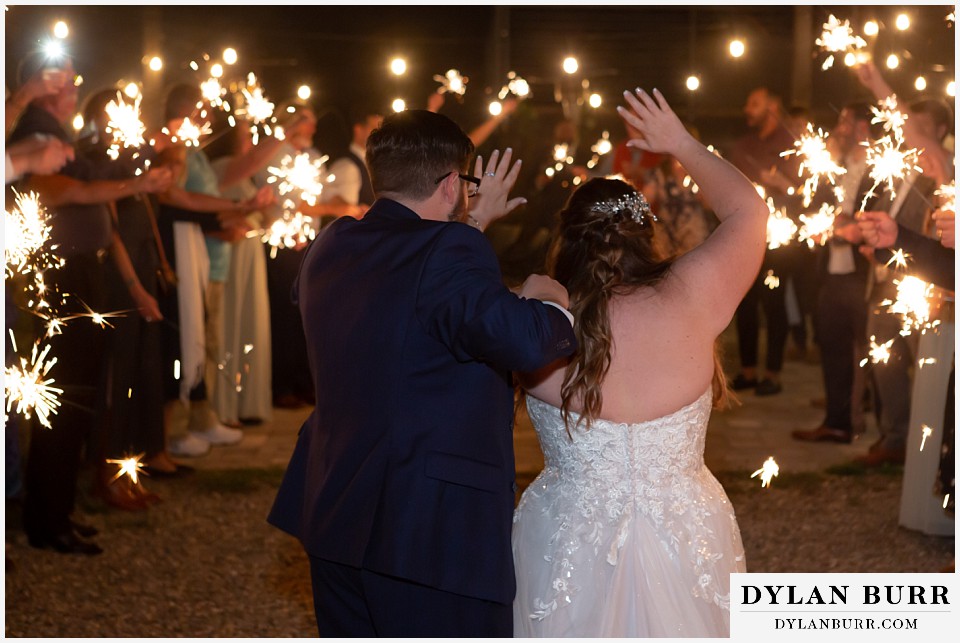 black diamond lodge wedding sparkler exit waving to guests