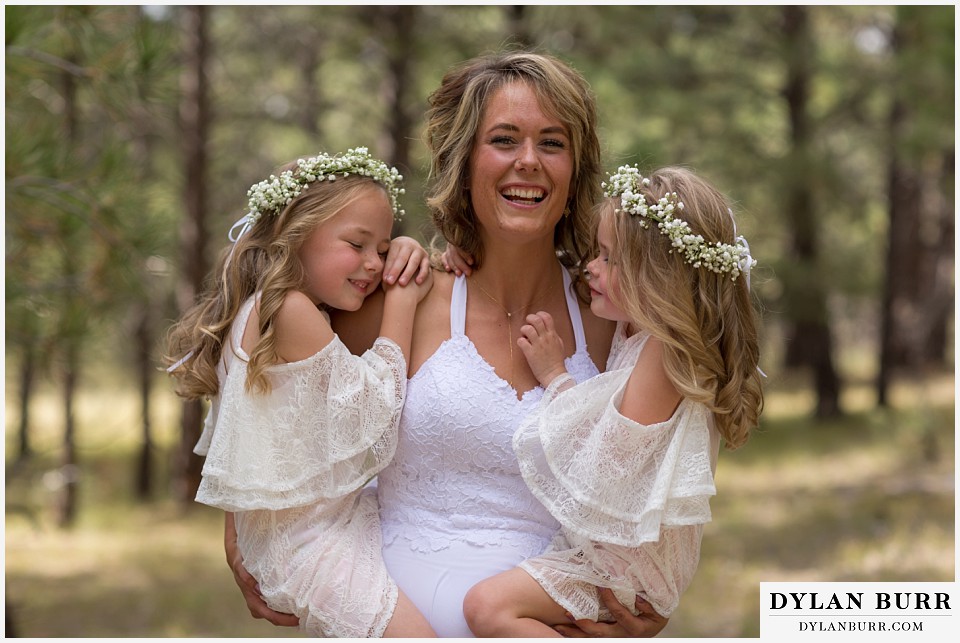 boho backyard colorado wedding bride laughing with daughters