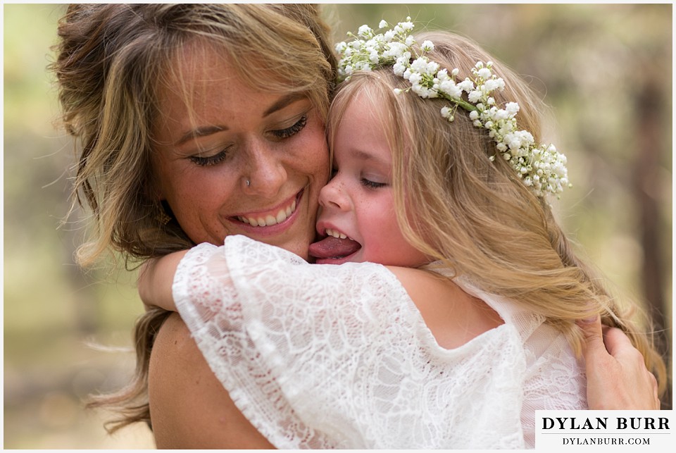 boho backyard colorado wedding goofy daughter licking moms face