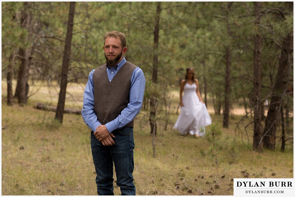 boho backyard colorado wedding first look with groom