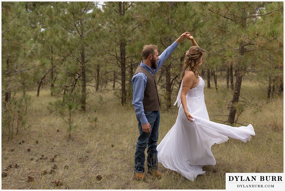 boho backyard colorado wedding bride and groom dancing in forest