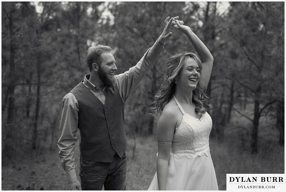 boho backyard colorado wedding bride and groom dancing and laughing