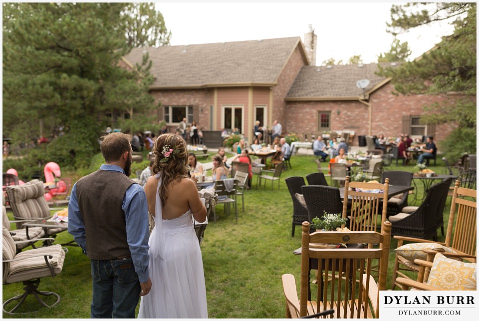 boho backyard colorado wedding bride and groom telling their love story