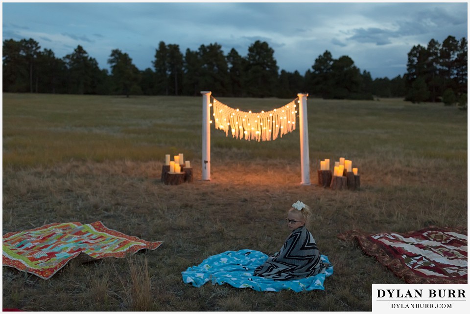 boho backyard colorado wedding girl waits for the wedding ceremony