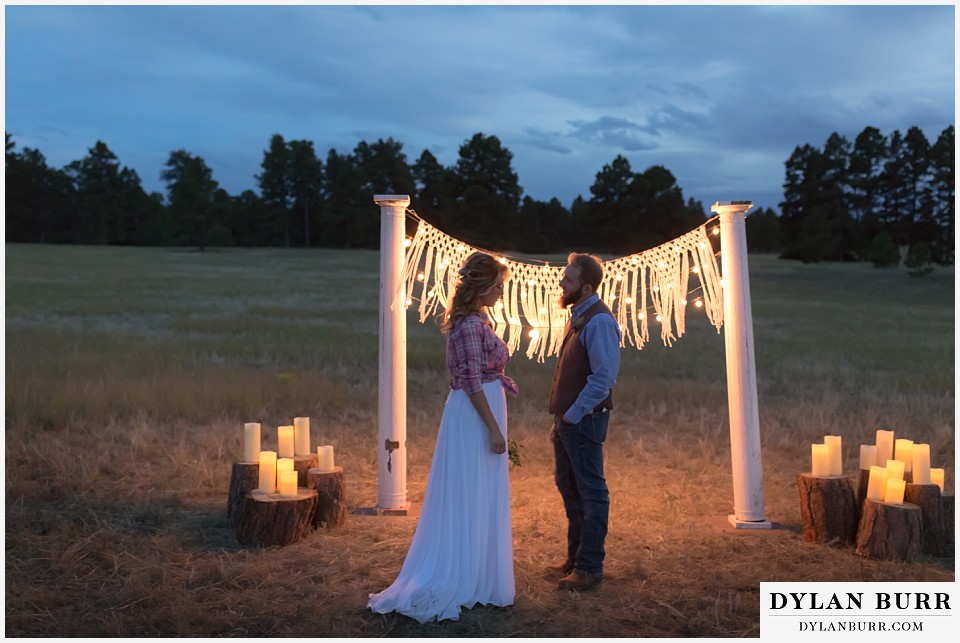 boho backyard colorado wedding bride and groom stand with each other