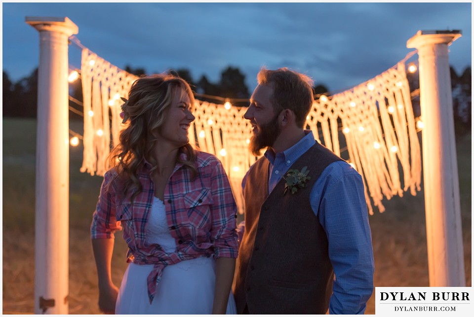 boho backyard colorado wedding bride and groom laughing together