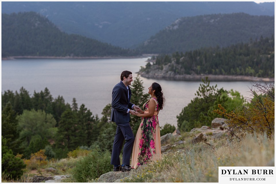 boulder colorado engagement session in the mountains stopping for a moment to hold hands