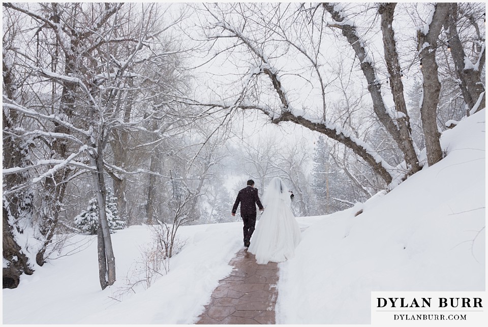 boulder creek by wedgewood weddings bride and groom walking together in snowy trees