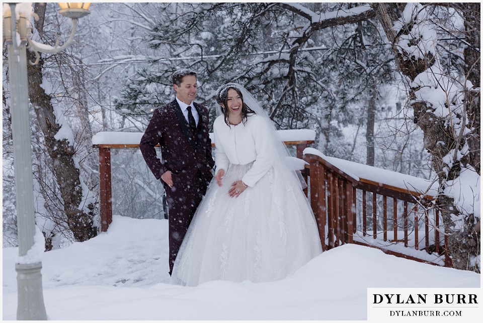 boulder creek by wedgewood weddings couple laughing together in falling snow