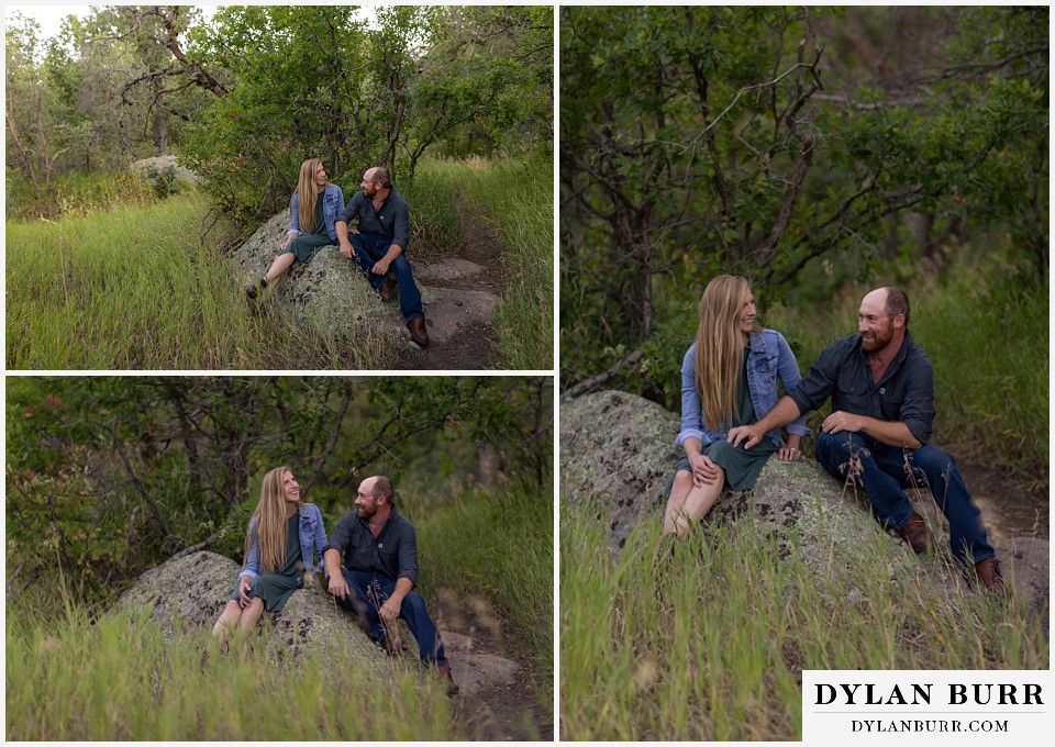 castlewood canyon engagement photos couple sitting on rock together