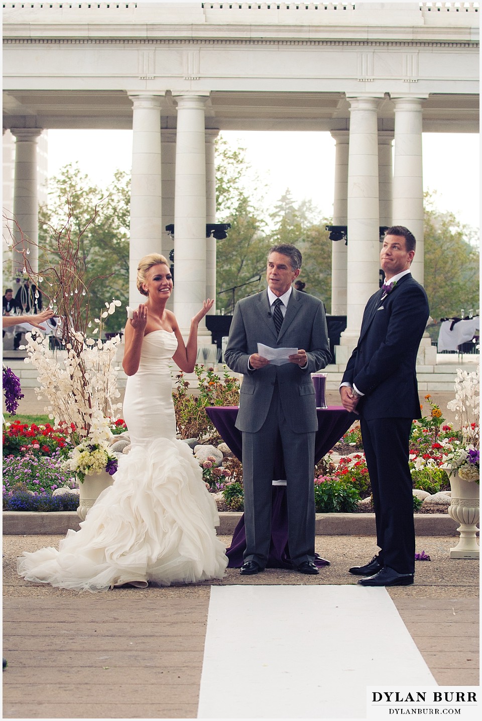 cheesman park pavilion wedding bride and groom as rain begins to fall
