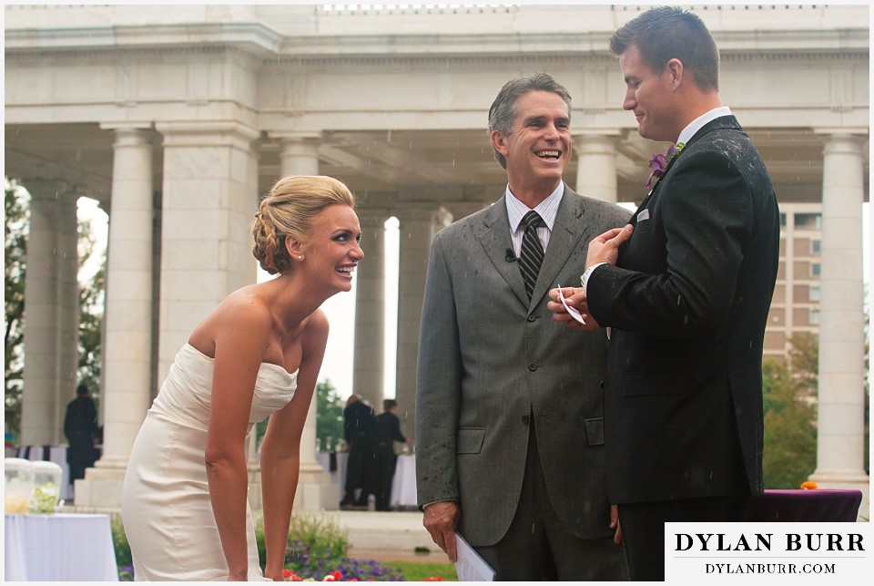cheesman park pavilion wedding groom reading vows bride having a laugh