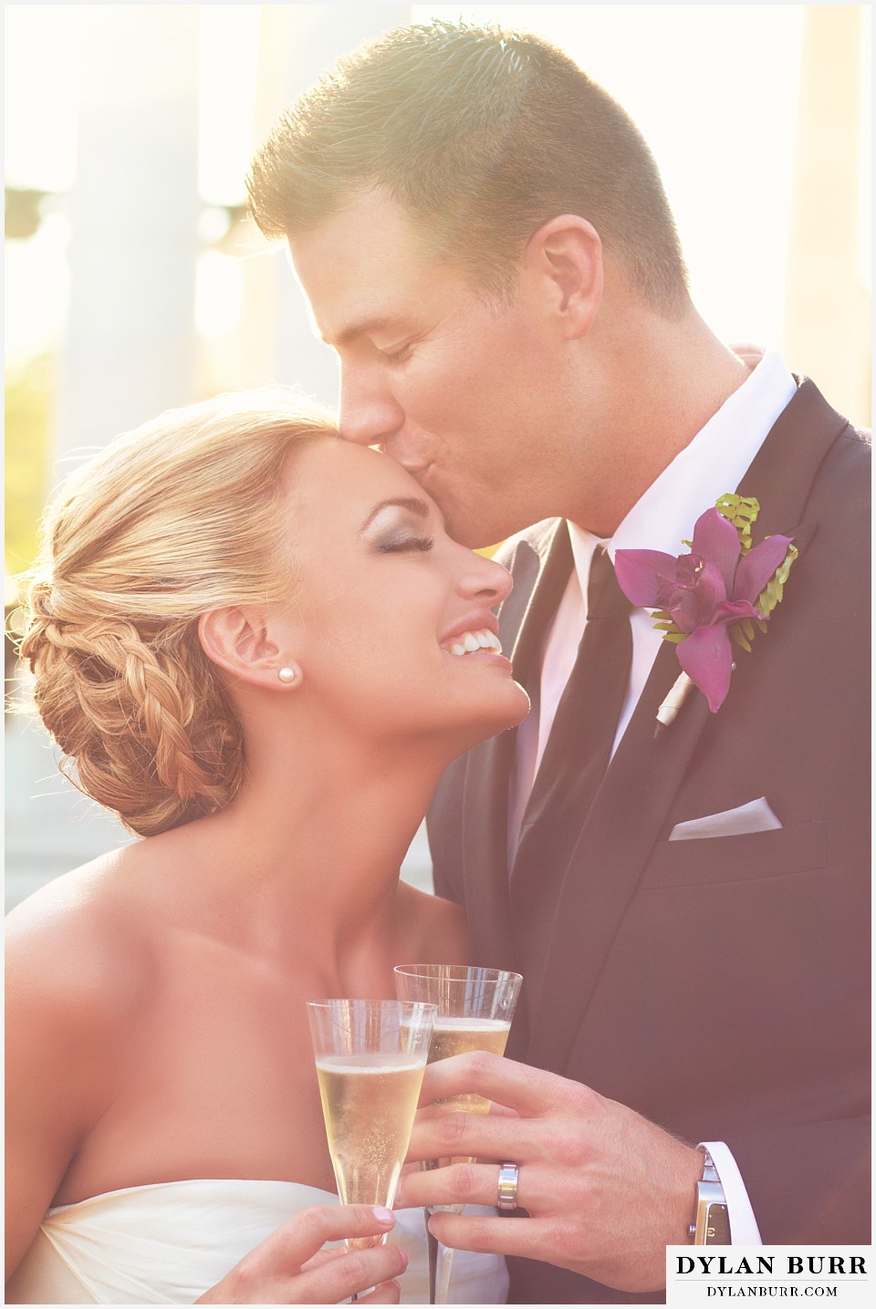 cheesman park pavilion wedding bride and groom kissing and champagne toast