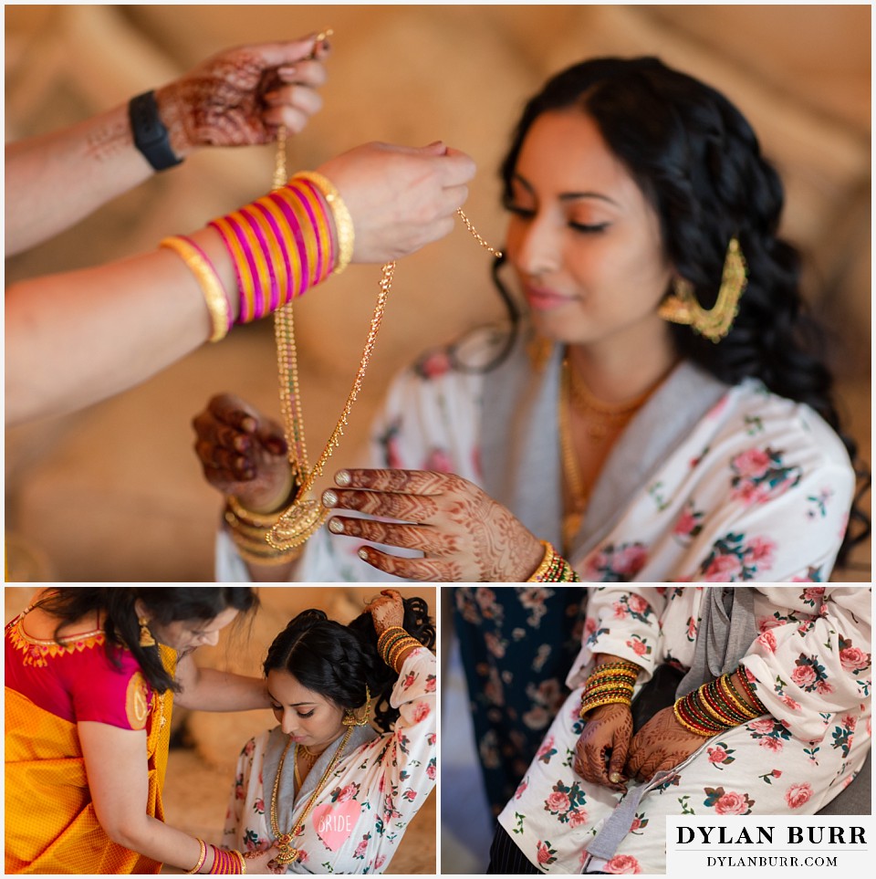 cielo at castle pines wedding colorado mountain wedding bride putting on necklace henna hands and bangles