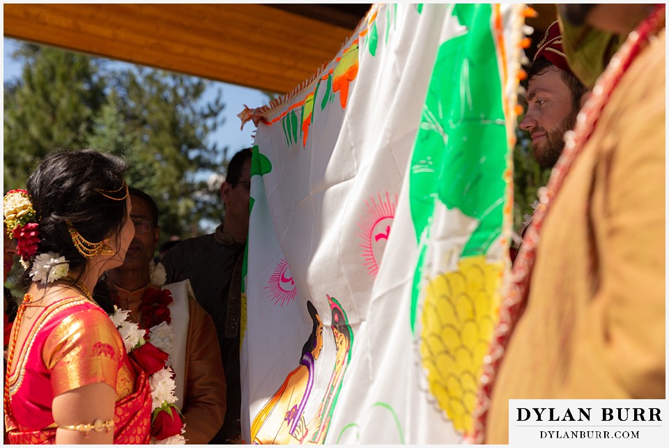 cielo at castle pines wedding colorado mountain wedding bride and groom wait to see each other hindu ceremony