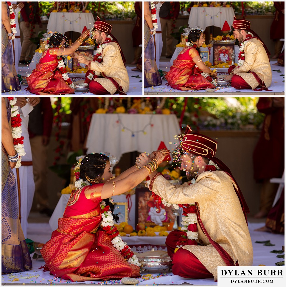 cielo at castle pines wedding colorado mountain wedding bride and groom throwing confetti on each other hindu ceremony