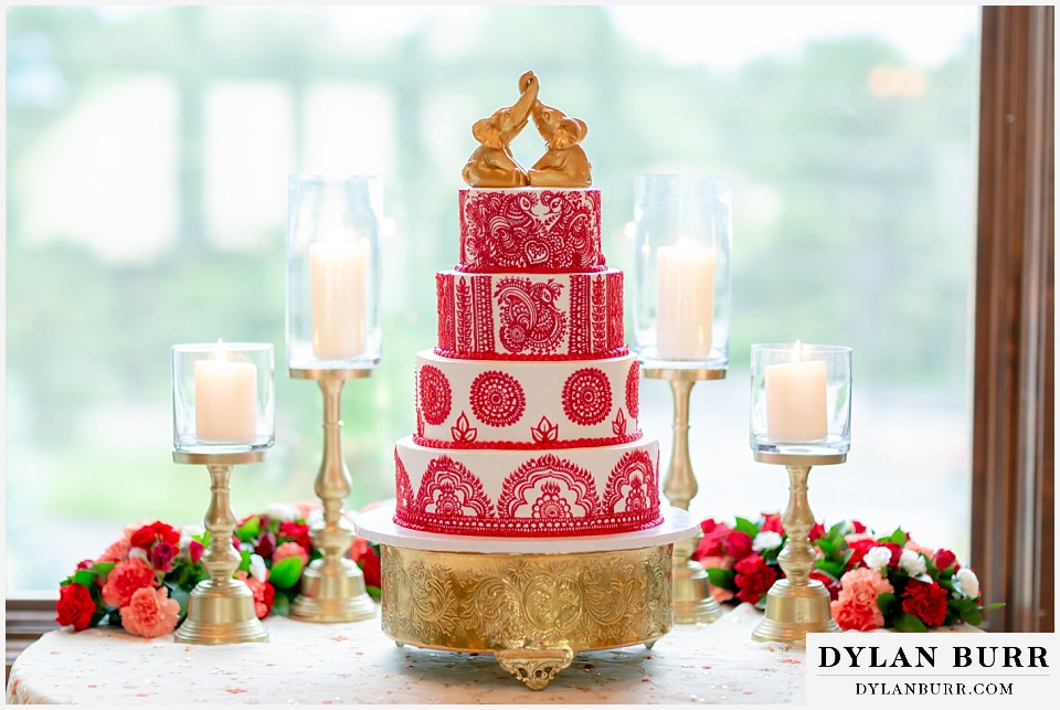 cielo at castle pines wedding colorado mountain wedding hand iced henna indian design cake with gold elephant topper