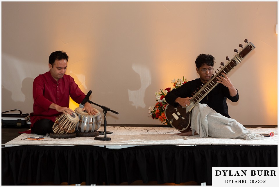 cielo at castle pines wedding colorado mountain wedding tabla and sitar musicians play during hindu wedding reception