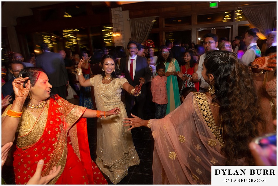 cielo at castle pines wedding colorado mountain wedding close family hindu bride dancing