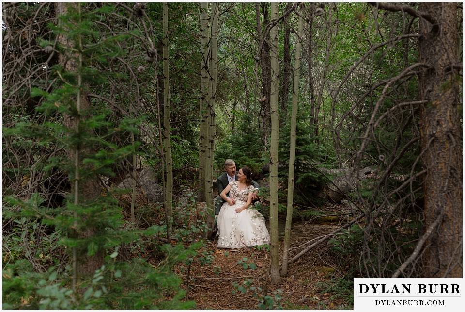 clinton gulch micro wedding sitting together in the deep forest