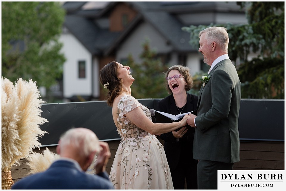 10 mile music hall micro wedding laughing together with wedding officiant