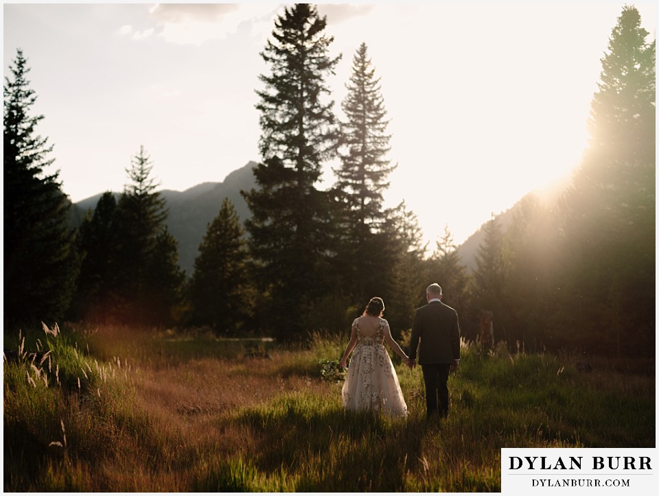 10 mile music hall micro wedding couple together in the trees and mountains at sunset
