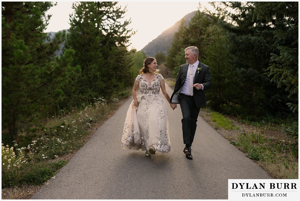 10 mile music hall micro wedding skipping together on path