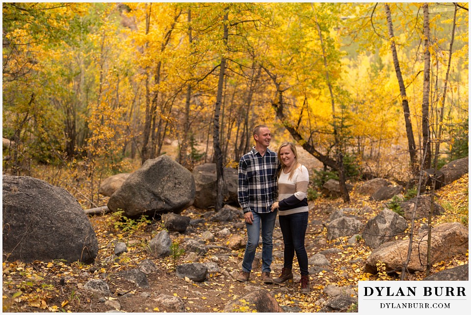 engagement photos in colorado couple stopping on mountain trail