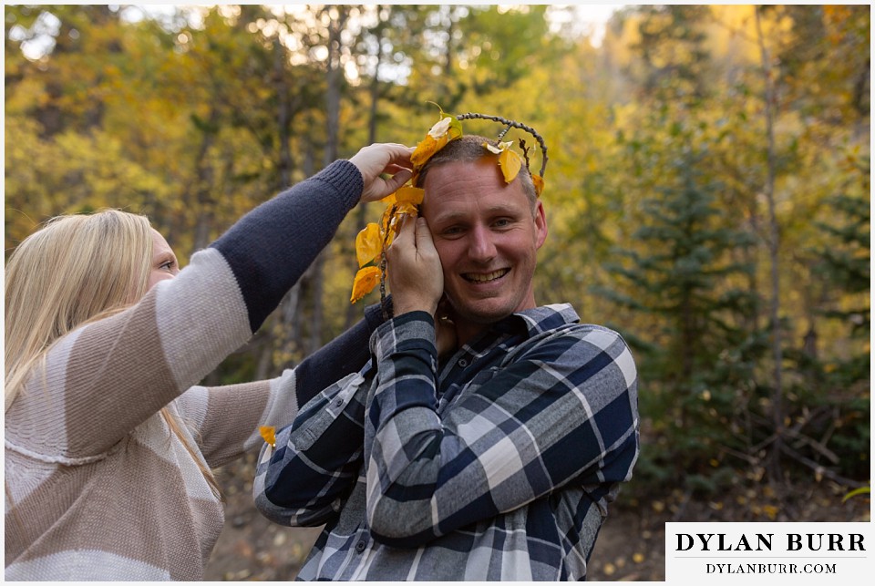 engagement photos in colorado couple being goofy making a aspen leaf crown