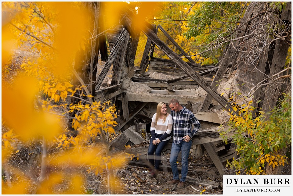 engagement photos in colorado couple by old 1800s building