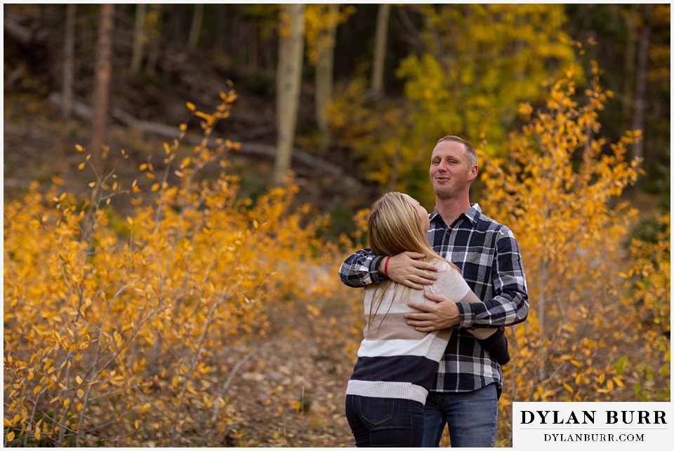 engagement photos in colorado holding each other