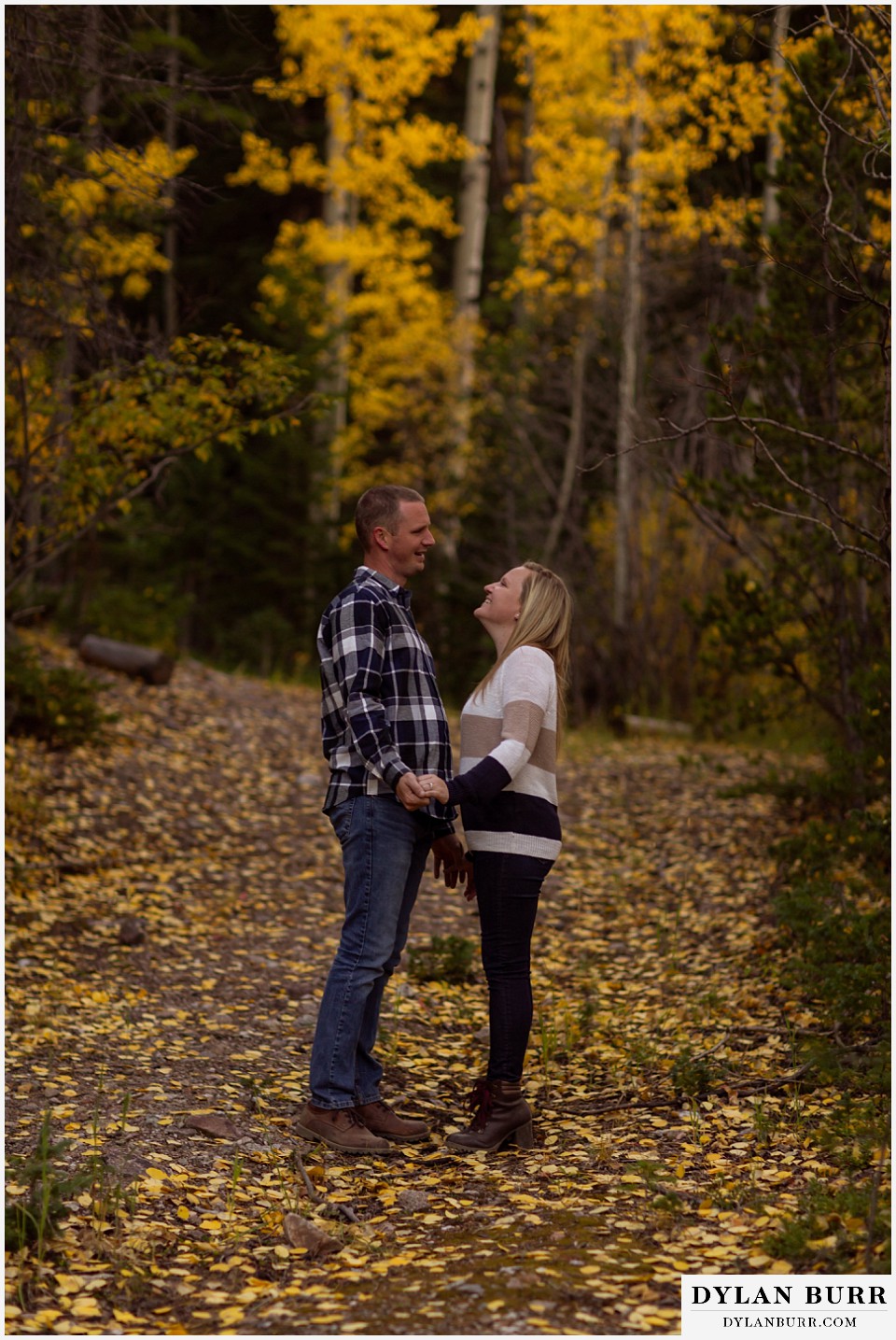 engagement photos in colorado fall late afternoon couple on mountain road