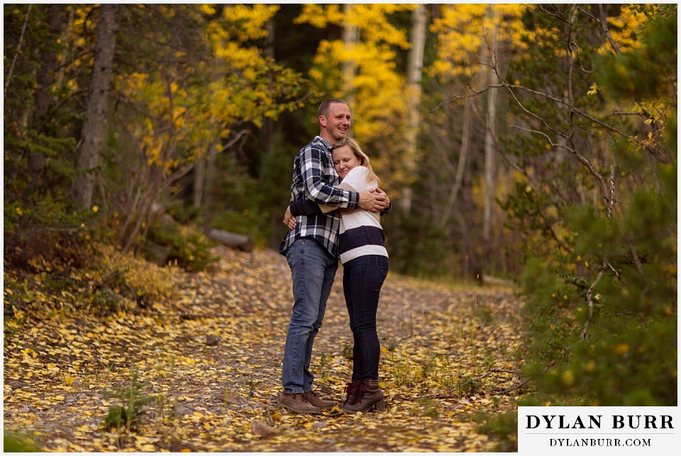 engagement photos in colorado couple hugging each other