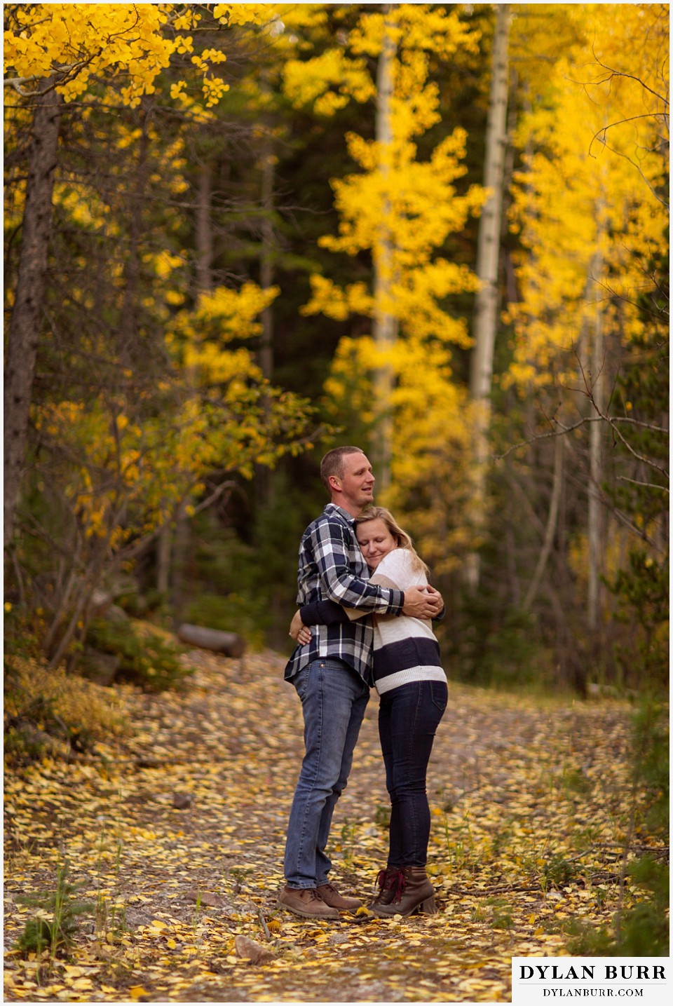 engagement photos in colorado sweet couple hugging each other