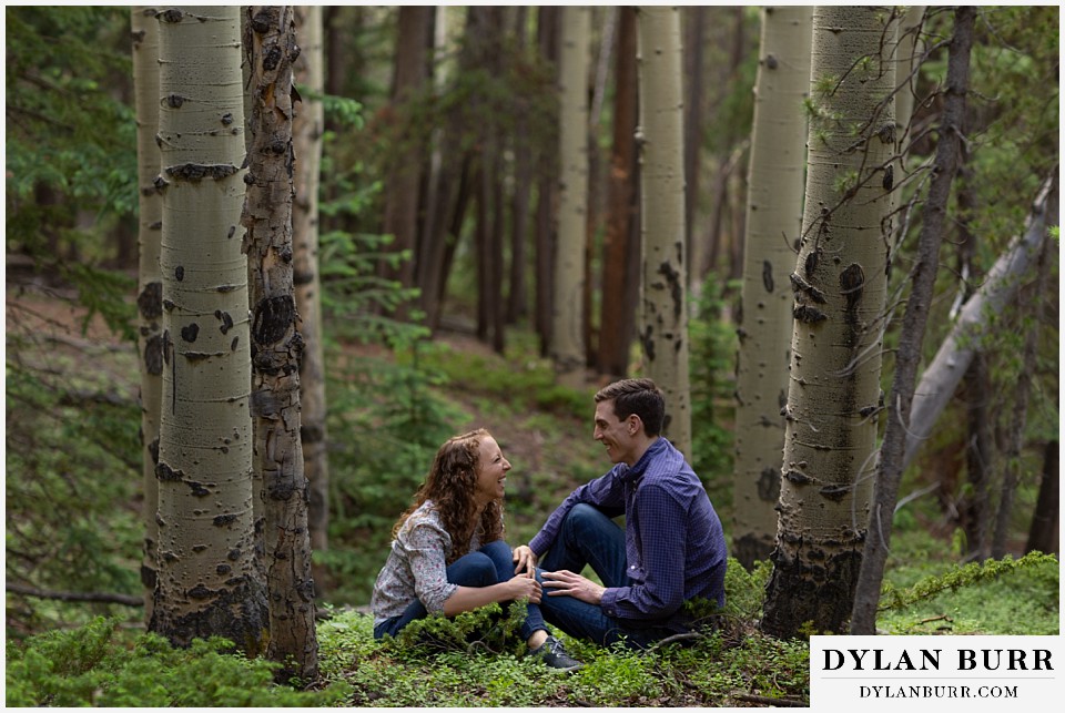colorado mountain enagagement photo session having fun together in forest
