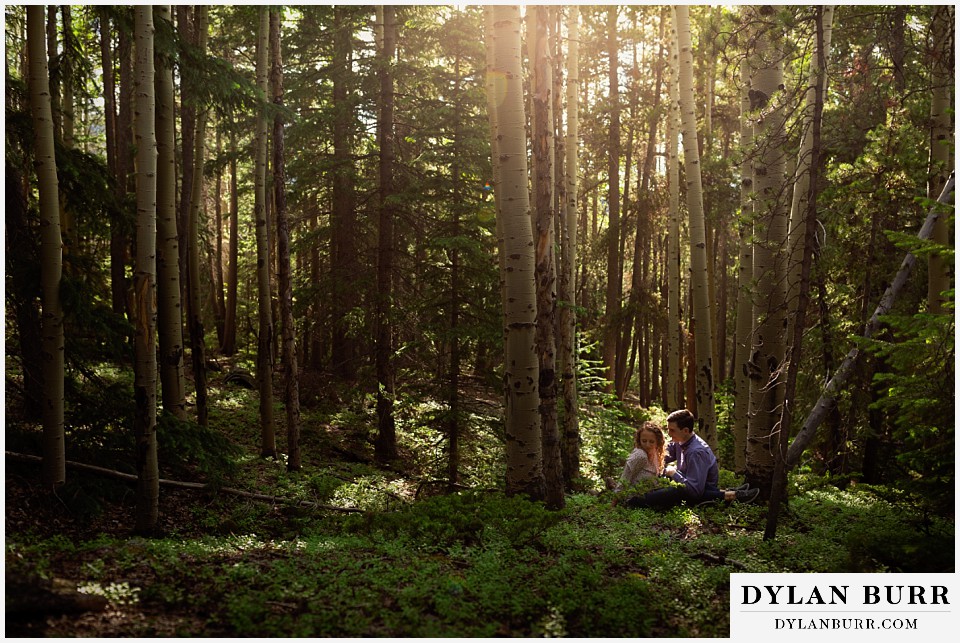 colorado mountain enagagement photo session wide forest view of couple