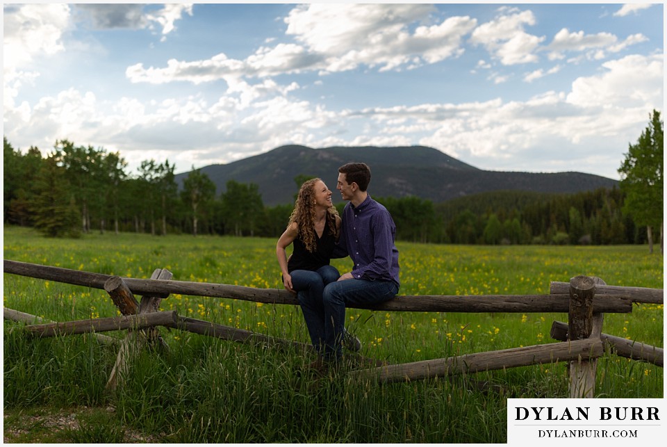 colorado mountain enagagement photo session in mountain meadow with wildflowers