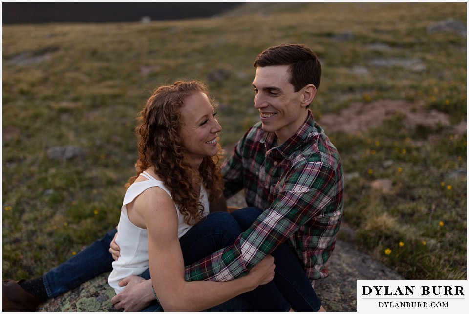 colorado mountain enagagement photo session couple at sunset with alpine wildflowers