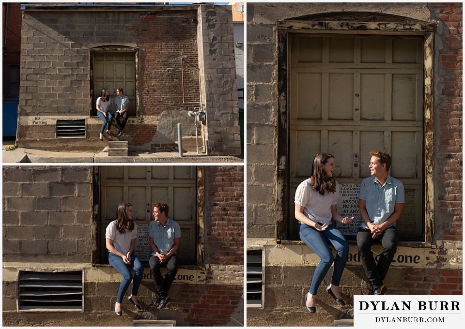 colorado mountain engagement photos colorado wedding photographer dylan burr couple hanging out by old garage door laughing