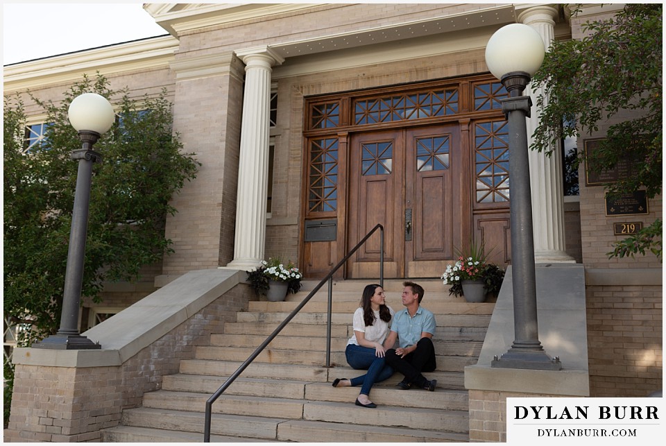 colorado mountain engagement photos colorado wedding photographer dylan burr couple sitting on steps of library