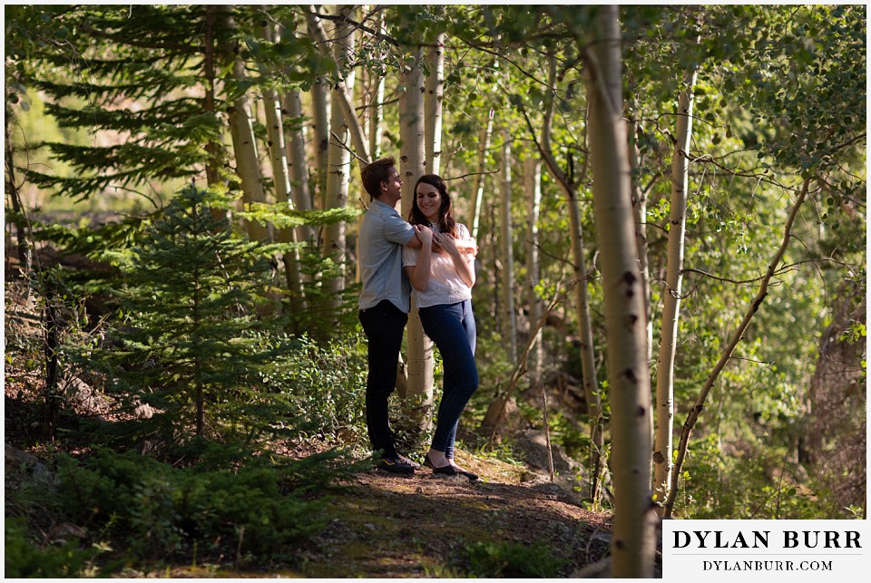 colorado mountain engagement photos colorado wedding photographer dylan burr couple holding each other in aspen trees