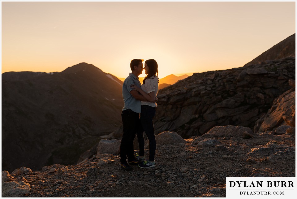 colorado mountain engagement photos colorado wedding photographer dylan burr couple going in for a kiss at sunset