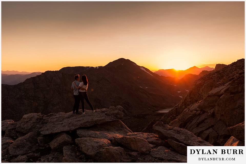 colorado mountain engagement photos colorado wedding photographer dylan burr couple watching sunset on top of mountains