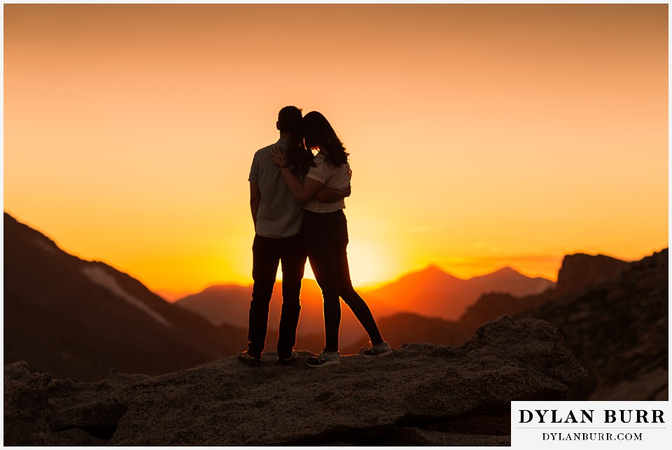 colorado mountain engagement photos colorado wedding photographer dylan burr couple snuggling in close during sunset