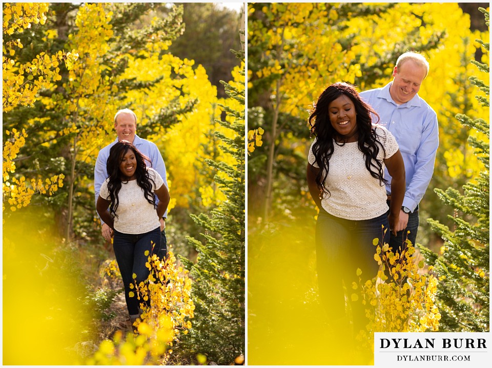 colorado mountain engagement photos couple walking in yellow aspen trees