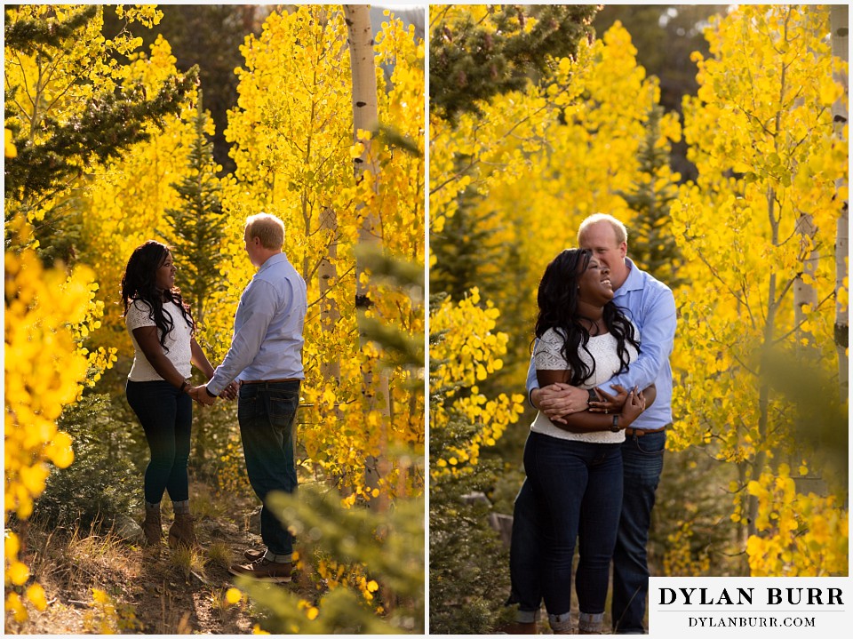 colorado mountain engagement photos couple laughing together in yellow aspen leaves