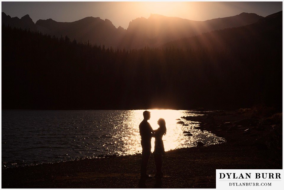 colorado engagement photos in mountains couple in silhouette