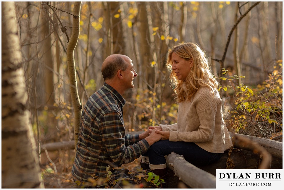 colorado engagement session in mountains couple relaxing for a moment